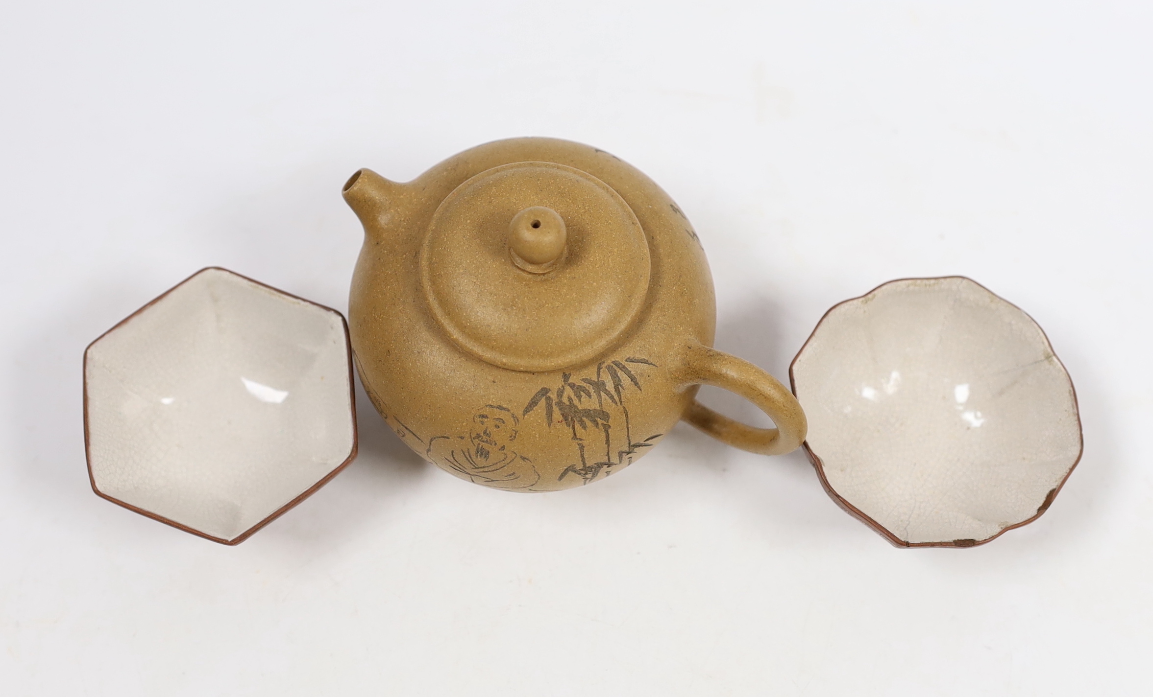 A Chinese Yixing teapot, seal mark to base and two enamelled cups